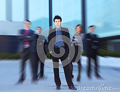 A team of young business persons in formal clothes