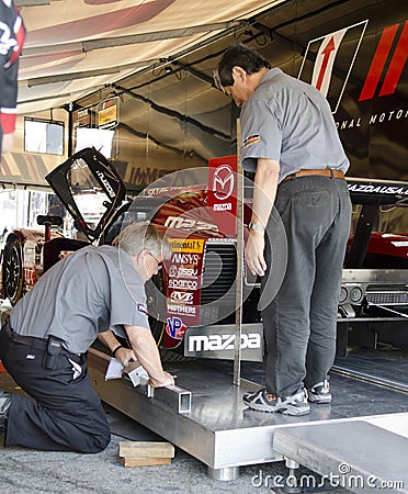 Tech Inspection Workers Measure Car