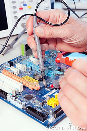 Tech tests electronic equipment