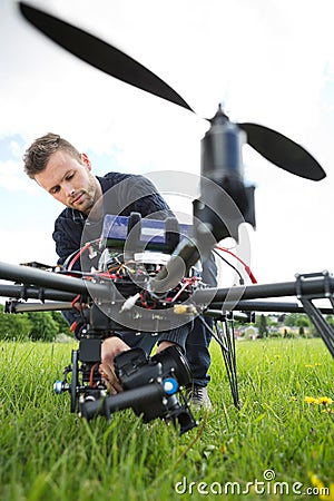 Technician Fixing Camera On Spy Drone