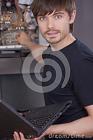Technician fixing problem on computer