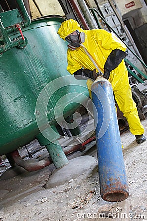 Technician in protective uniform, mask,gloves deal