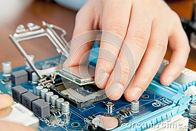 Technician repairing computer hardware in the lab