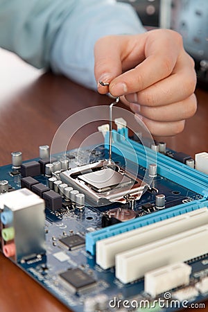 Technician repairing computer hardware in the lab