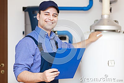 Technician repairing an hot-water heater