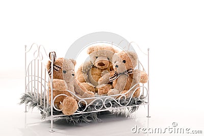 Teddy bears in the bed.