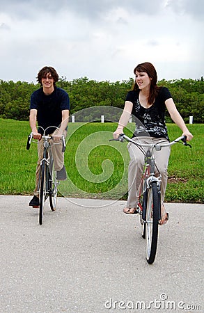 Teen couple riding bikes