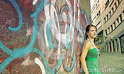 Teen girl and graffiti wall