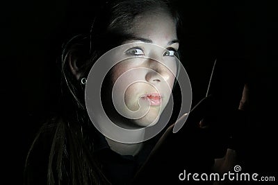 Teen Girls Face Lit by Cell Phone