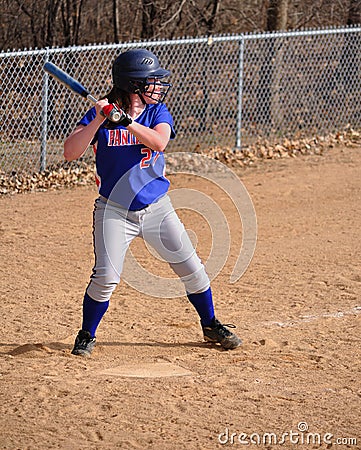 Teen Girl Softball Player Batting