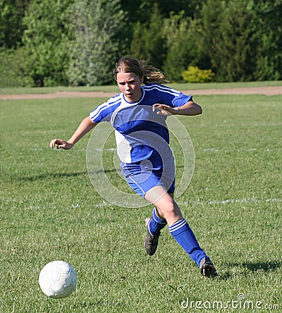 Teen Youth Soccer Player Chasing Ball