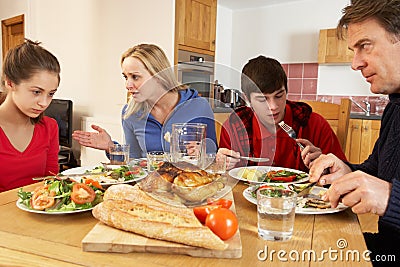 Teenage Family Having Argument Whilst Eating Lunch