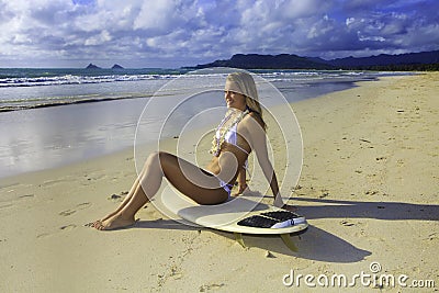 Teenage girl with her surfboard