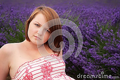 Teenage girl posing against lavender field