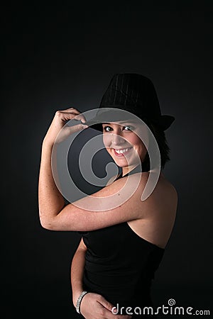 Teenage girl in retro gangster style hat and dress