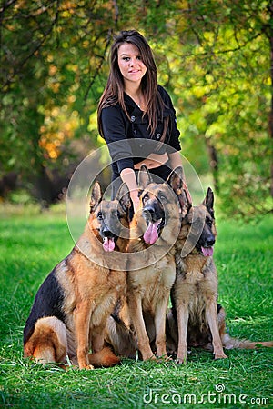 Teenage girl with three dogs