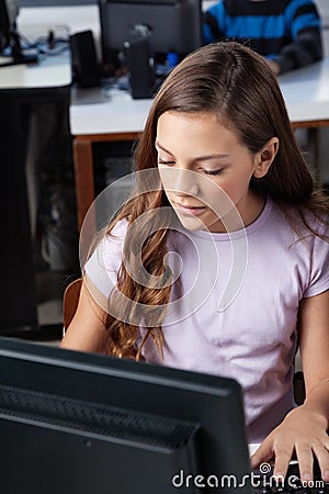 Teenage Schoolgirl Using Desktop Pc