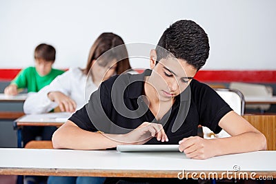 Teenage University Student Using Digital Tablet At