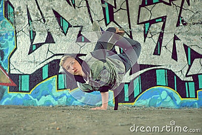 Teenager dancing break dance on the street