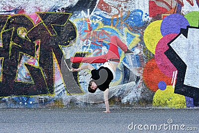 Teenager dancing break dance on the street