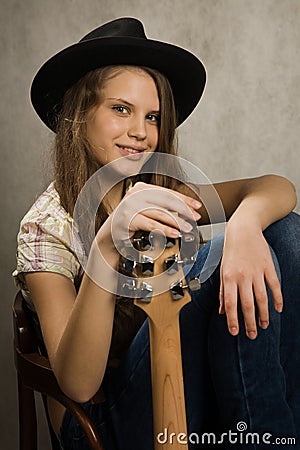 Teenager girl with electric guitar