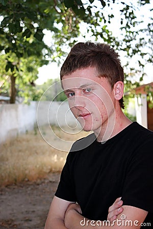 Teenager with pimples on his face portrait
