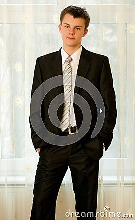 Teenager in smart black suit