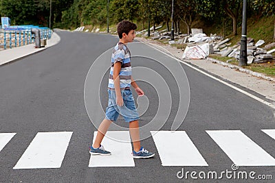 Teenager through a zebra crossing