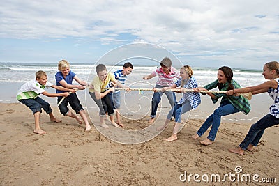 Teenagers playing tug of war