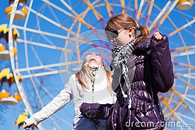 Teens against a ferris wheel