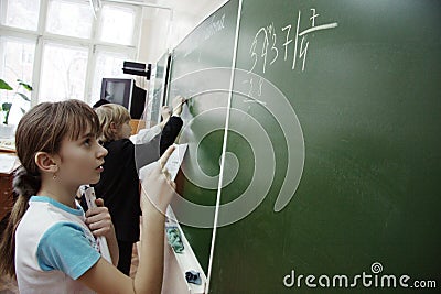 Teens on math lesson at school