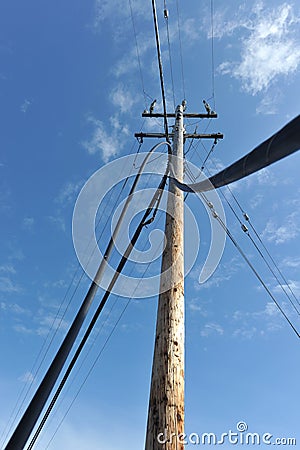 Telephone pole with wires coming to the ground