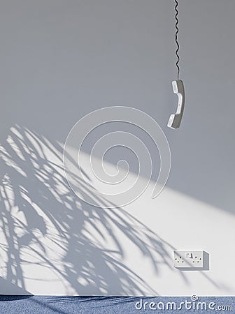 Telephone Receiver Hanging In Empty Room