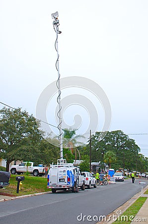 Television news camera crew van with antenna