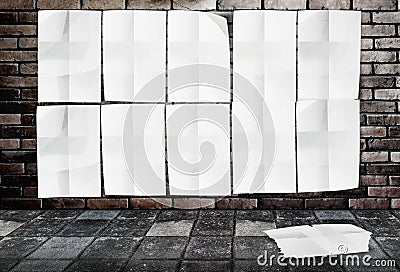 Template- Wall of Crumpled Posters on brick wall & footpath grou
