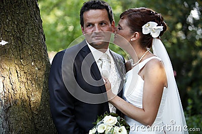 Tender wedding kiss