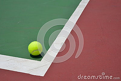 Tennis ball on green court