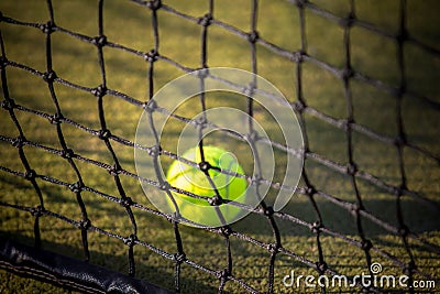 Tennis ball on the net