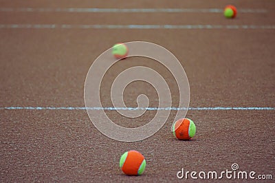 Tennis balls on clay court