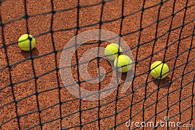 Tennis balls on clay court