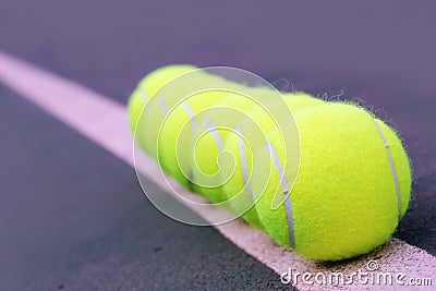 Tennis balls closeup on hard court tennis turf