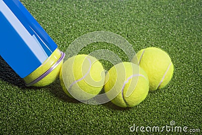 Tennis concept: tennis balls out of a container