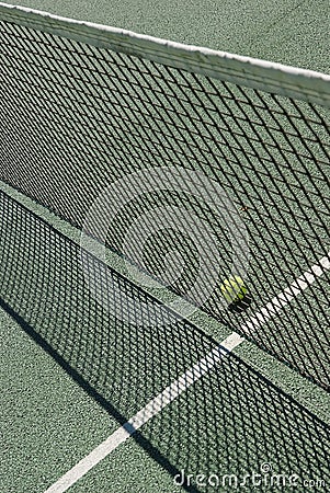 Tennis court net and ball