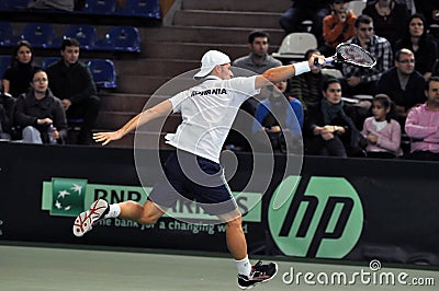 Tennis man Adrian Ungur in action at a Davis Cup match