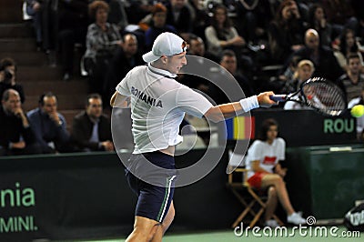 Tennis man Adrian Ungur in action at a Davis Cup match