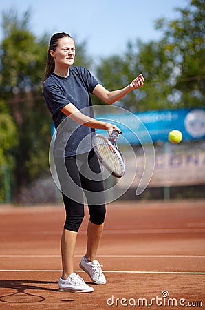Tennis player executing a forehand volley