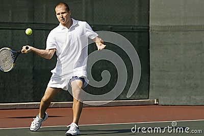 Tennis Player Swinging Racket in Forehand Motion