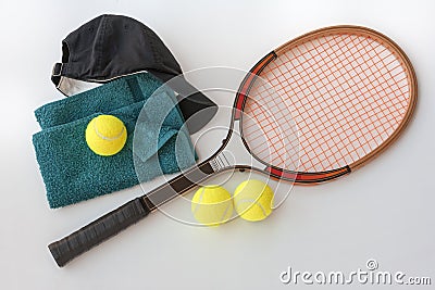 Tennis racket with balls cap and towel