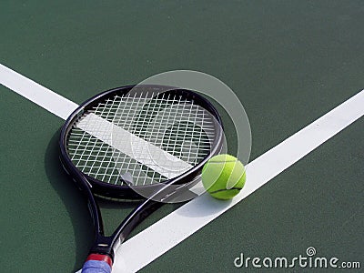 Tennis racquet and Ball on a tennis court