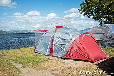 Tents on a camping site near a lake